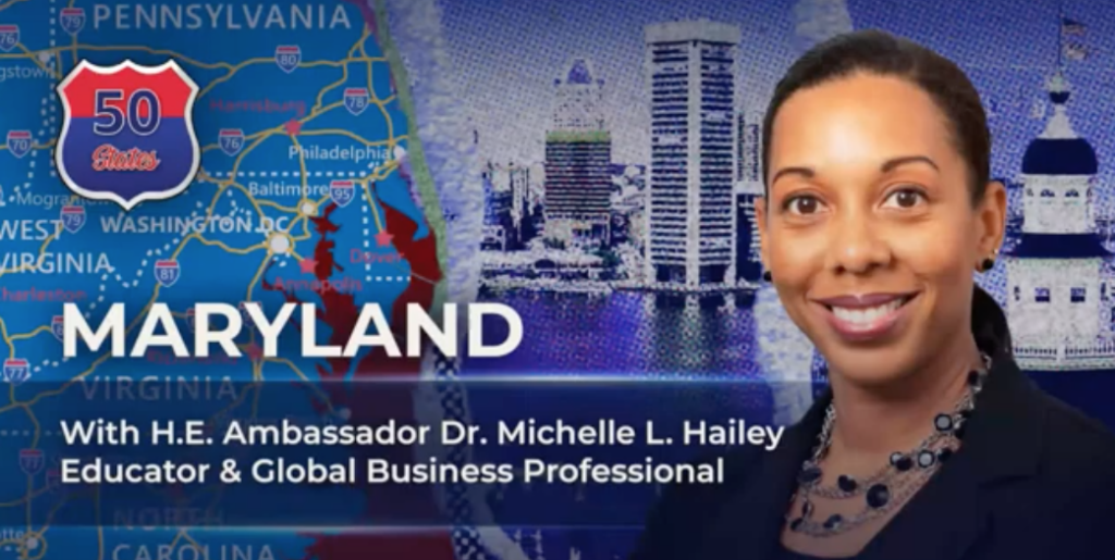 Dr. Michelle L Hailey poses for a photo in front of a state map of Maryland and a skyline.