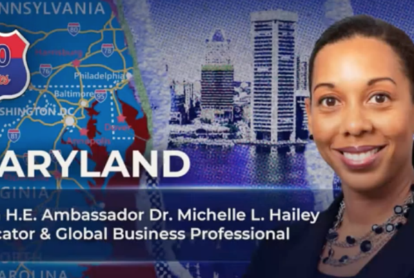 Dr. Michelle L Hailey poses for a photo in front of a state map of Maryland and a skyline.